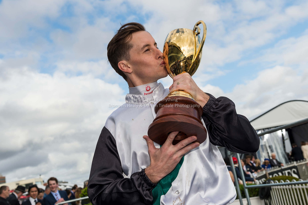Jockey Corey Parish with Caulfield cup trophy after Boom Time won the BMW Caulfield Cup. Pic Darren Tindale / The Image is Everything.