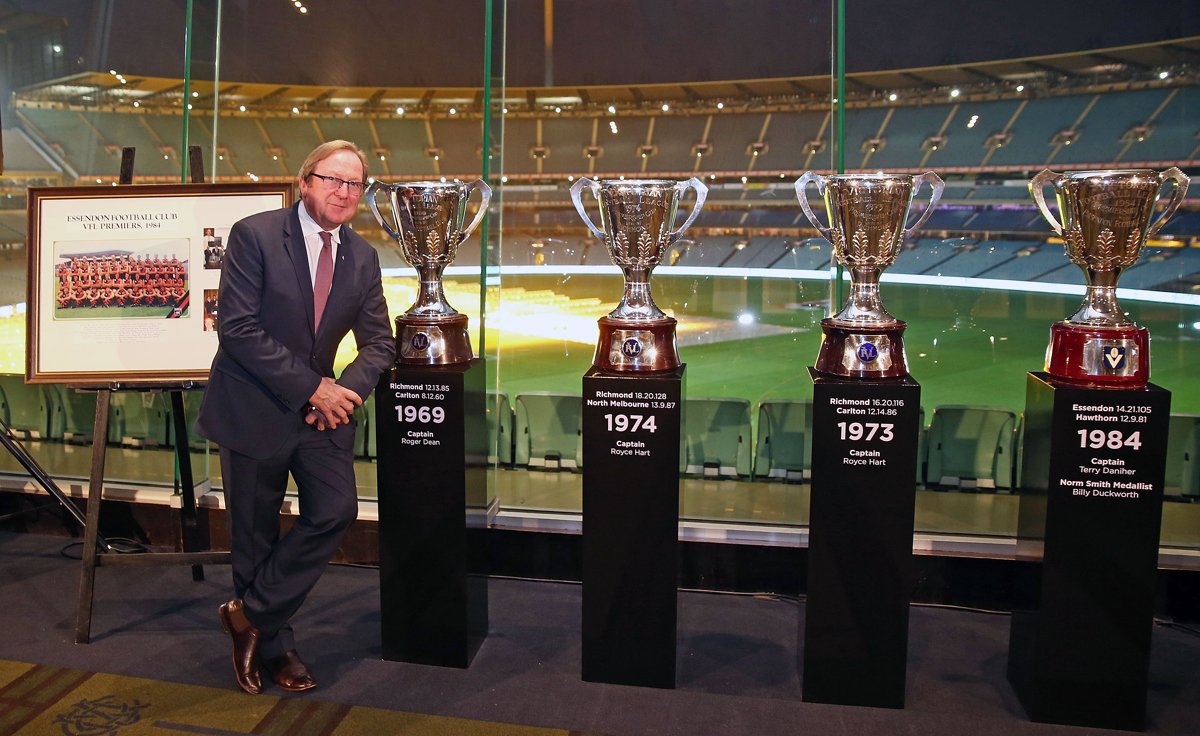Kevin Sheedy stands next to AFL Premiership Cups he won after being a part of seven premiership teams during the '50 Years of Sheeds' Dinner. Pic: Scott Barbour/AFL Media/Getty Images