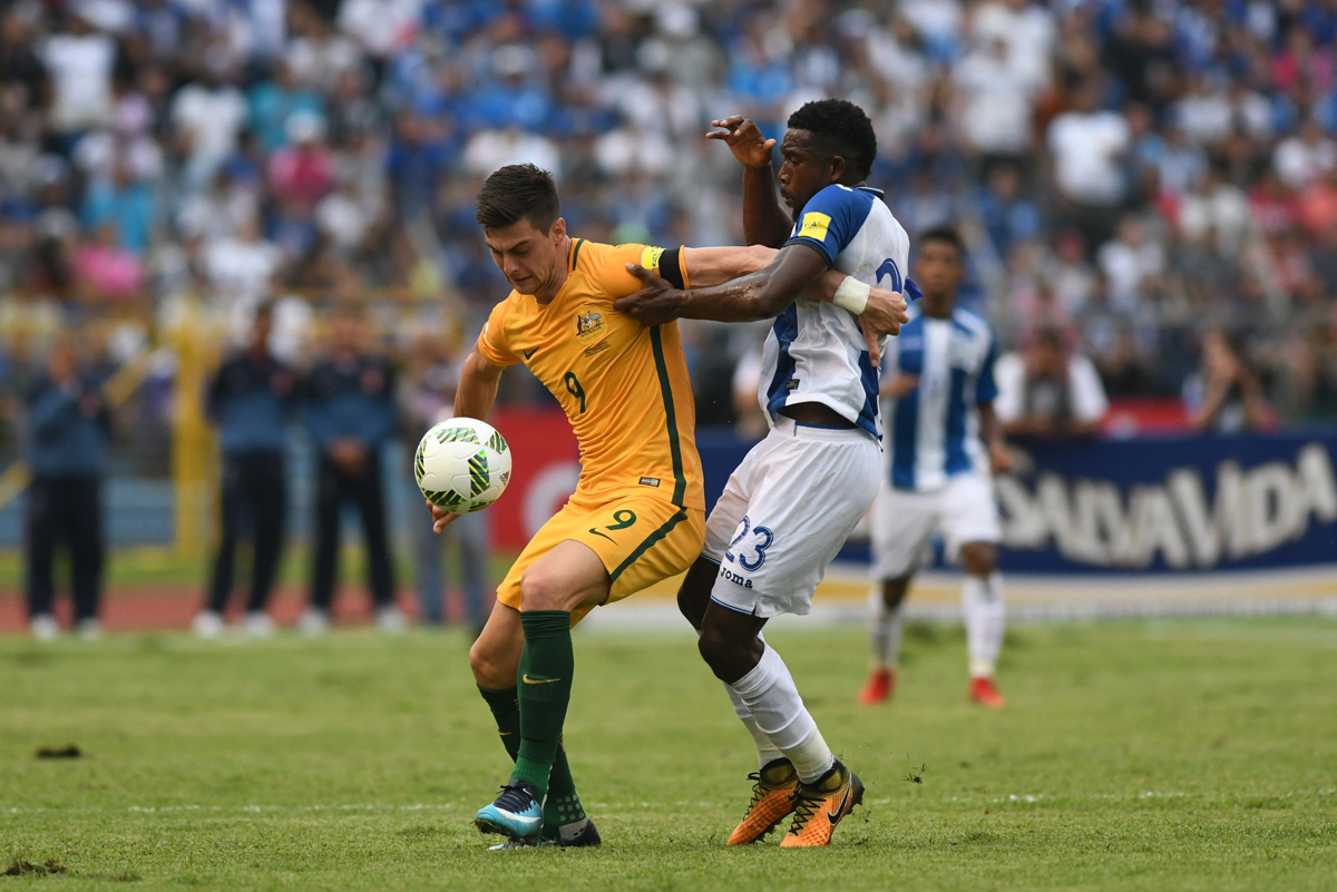 Australia's Tomi Juric (L) and Honduras' Johnny Palacios vie for the bal. Pic: ORLANDO SIERRA/AFP/Getty Images)