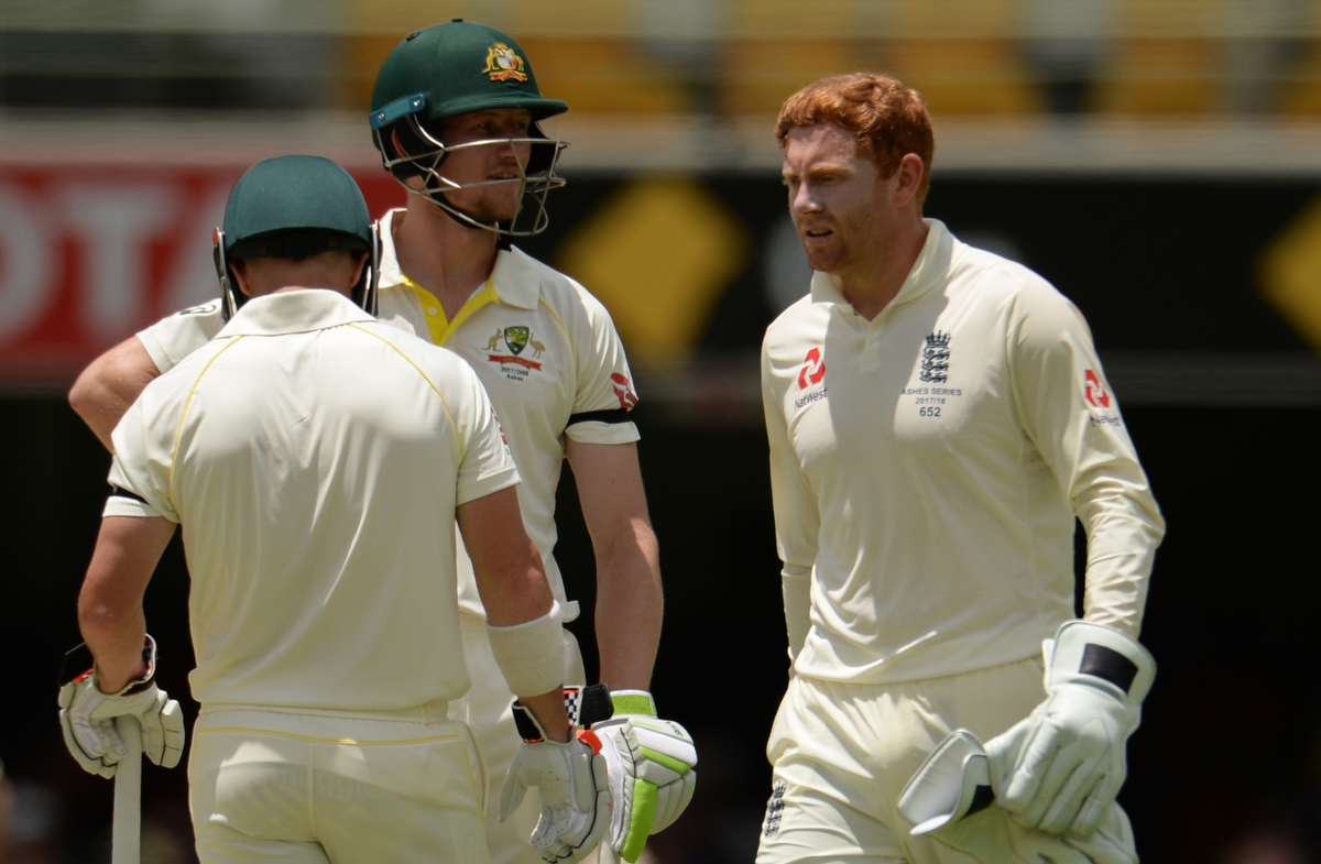 Jonny Bairstow walks past Cameron Bancroft and David Warner Pic: Philip Brown/Getty Images