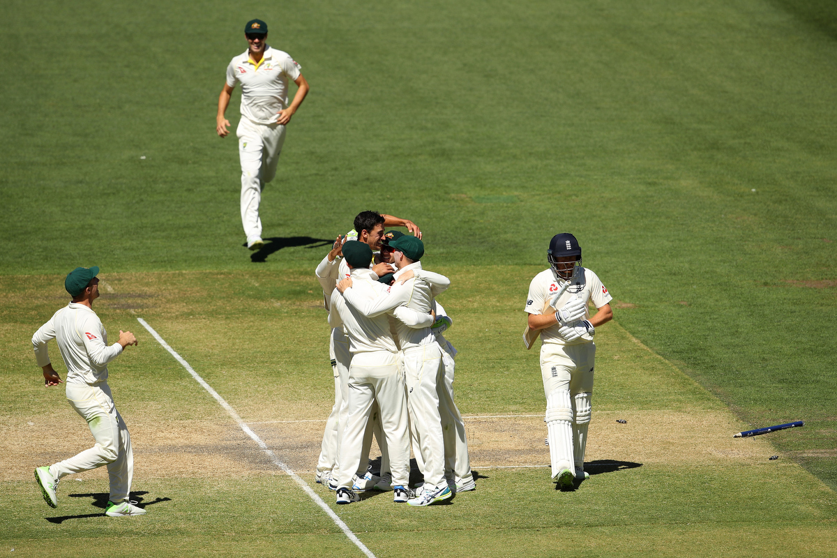 Mitchell Starc celebrates with team mates after taking the final wicket of Jonny Bairstowand winning the test Pic: Cameron Spencer/Getty Images