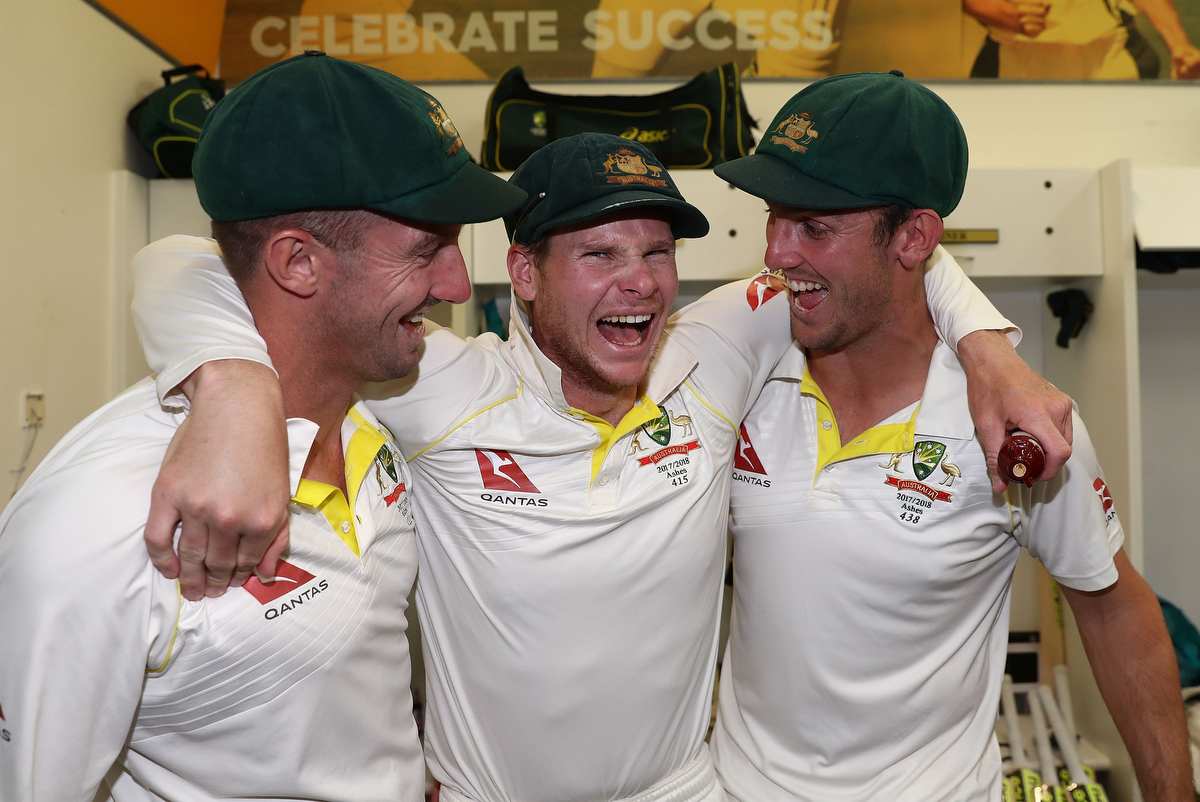 Shaun Marsh, Steve Smith and Mitch Marsh celebrate in the changerooms after Australia regained the Ashes. Pic: Ryan Pierse/Getty Images
