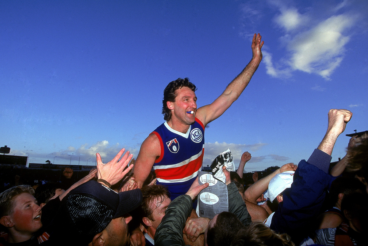 Doug Hawkins of the Bulldogs celebrates breaking the record of 322 AFL games. Pic: Getty Images