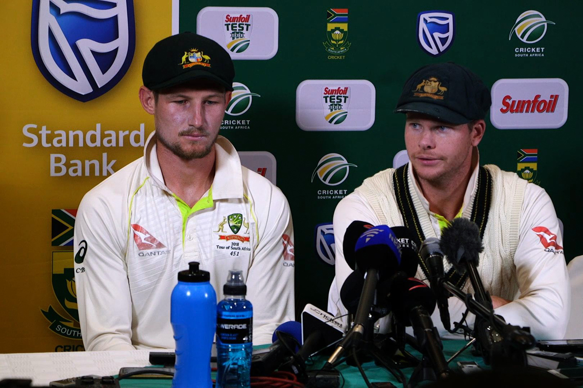 Cameron Bancroft and Steve Smith during the press conference. Pic: STR/AFP/Getty Images