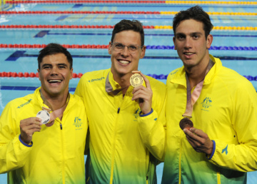 Commonwealth Games. Swimming Finals Night 4. Medal Ceremony for the Men's 50m Backstroke Final. Benjamin TREFFERS, Mitch LARKIN and Zac INCERTI