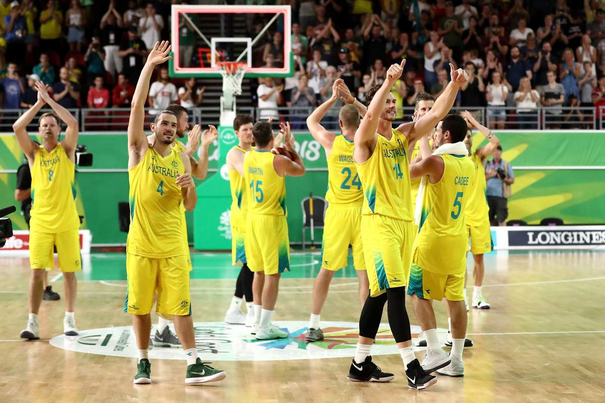 Australia celebrate winning gold in the Men's Basketball against Canada. Pic: Ryan Pierse/Getty Images