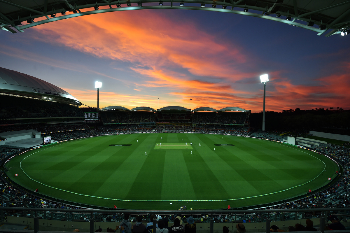 The sun sets during the first innings of the day-night third Test cricket match between Australia and South Africa at the Adelaide Oval. Pic: PETER PARKS/AFP/Getty Images