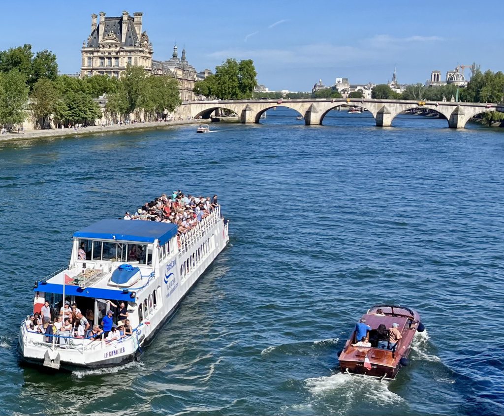 Local and tourist traffic on the River Seine in Paris.